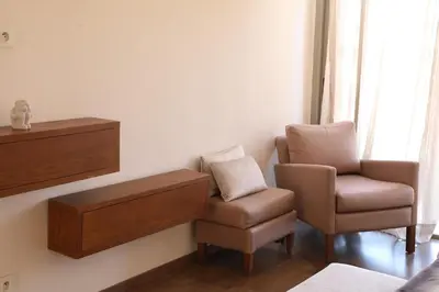 a room with a chair and a table and a chair and a chair at Mi Casita Luxury Villa marrakech in Marrakech
