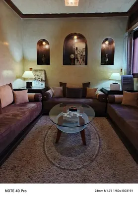 a living room with couches and a coffee table at La nuit est bonne in Marrakech