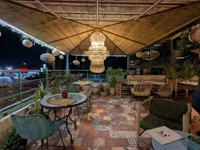 a patio with a table and chairs and a table and chairs at the old house in Marrakech