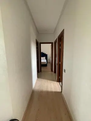 an empty room with a hallway with a bed at Oasis des Lumières in Marrakech