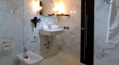 a bathroom with a sink and a shower at Marrakxi in Marrakech