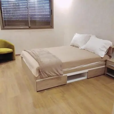 a bed sitting in a room with at Akenza hospitality in Marrakech