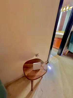 a table with a laptop sitting on top of it at MARRAKECH CENTRE Appartement in Marrakech