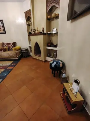 a living room with a couch and a table at Authentic Apartment Riad style in Marrakech in Marrakech