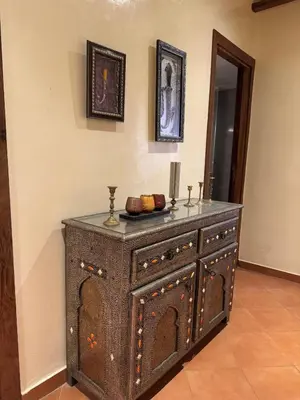 an old wooden dresser in a room at Authentic Apartment Riad style in Marrakech in Marrakech