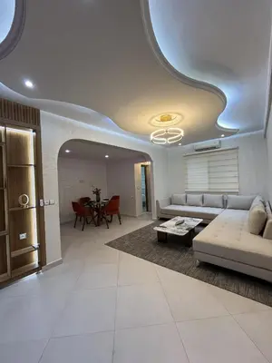 a living room with a couch and a table at Marrakech l'aéroport in Marrakech