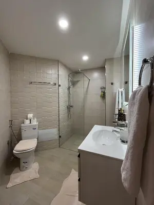 a bathroom with a toilet and a sink and a shower at Marrakech l'aéroport in Marrakech