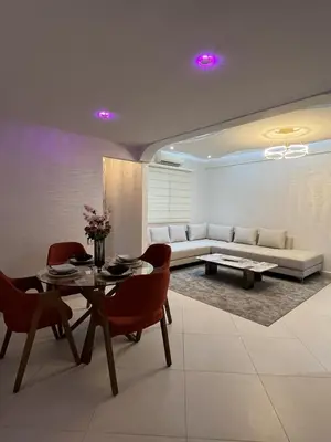 a living room with a couch and a table and chairs at Marrakech l'aéroport in Marrakech