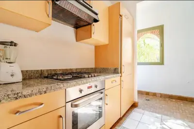 a kitchen with a stove and a counter top at Prestige authentique in Marrakech