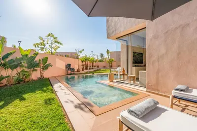 a swimming pool in the backyard of a house at Luxury 5-Star Villa - Games & Activities - 15 min to Center in Marrakech