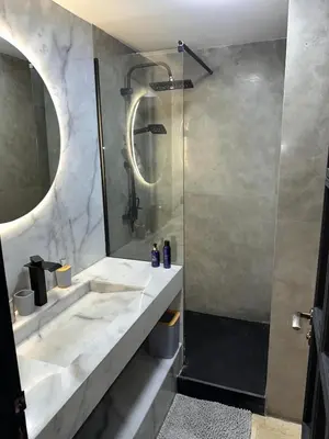 a bathroom with a shower and a sink at Duplex Sur Marrakech Guéliz in Marrakech