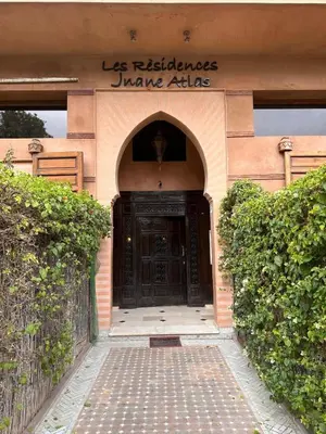 a entrance to a building with a black door at Duplex Sur Marrakech Guéliz in Marrakech