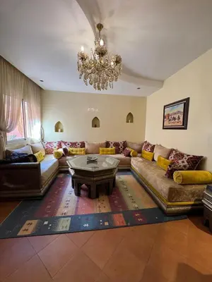 a living room with a couch and a coffee table at Authentic Apartment Riad Style in Gueliz for Family in Marrakech