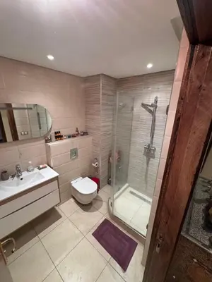 a bathroom with a shower and a toilet and a sink at Authentic Apartment Riad Style in Gueliz for Family in Marrakech