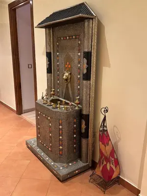a large wooden box sitting next to a wall at Authentic Apartment Riad Style in Gueliz for Family in Marrakech