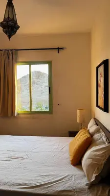 a bedroom with a large bed with a window at Bright with great view in Marrakech
