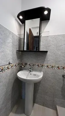 a bathroom with a sink and a mirror at Bright with great view in Marrakech