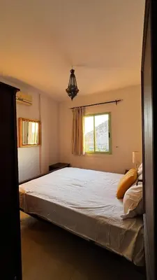 a bedroom with a large white bed with a window at Bright with great view in Marrakech