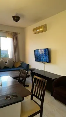 a living room with a couch and a table at Bright with great view in Marrakech