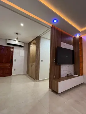 a living room with a tv and a large mirror at Modern Apartment with Fully Equipped Kitchen Perfect Location in Marrakech in Marrakech