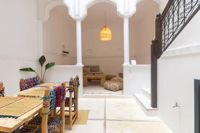 a dining room with a table and chairs at HM40 I Moroccan Riad with Residential Pool in Marrakech
