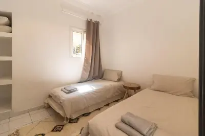 a room with two beds and a window at HM40 I Moroccan Riad with Residential Pool in Marrakech