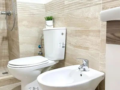 a bathroom with a toilet and a sink at Apartment in City Center - Gueliz in Marrakech