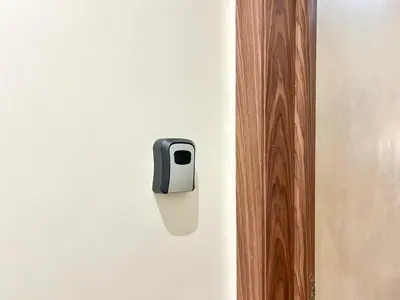a black and white outlet on a white wall at Apartment in City Center - Gueliz in Marrakech