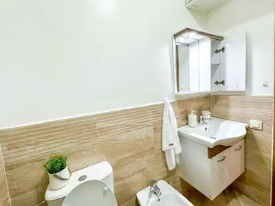 a bathroom with a toilet and a sink at Apartment in City Center - Gueliz in Marrakech