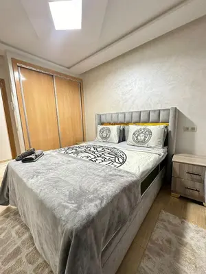 a bedroom with a large bed in a room at appartement elegant in Marrakech
