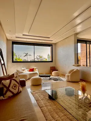 a living room with couches and a large window at Villa ARGANA 6 chambres avec piscine jacuzzi et hammam à Argan Golf 10 min du centre in Marrakech