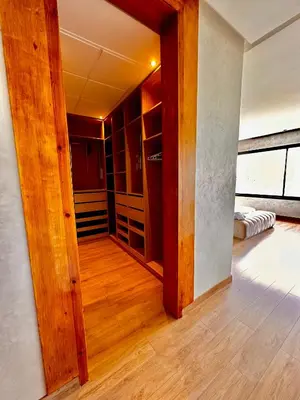 a room with a door open to a closet at Villa ARGANA 6 chambres avec piscine jacuzzi et hammam à Argan Golf 10 min du centre in Marrakech
