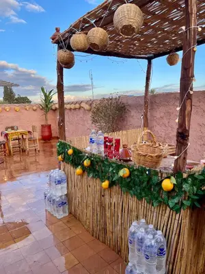 a table with a bunch of bottles of water at Red Vibes Hostel Marrakech in Marrakech