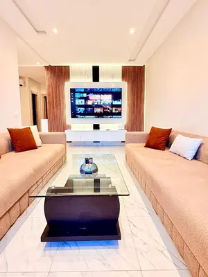 a living room with two couches and a tv at N17 Agréable Confortable & Près De Gueliz in Marrakech