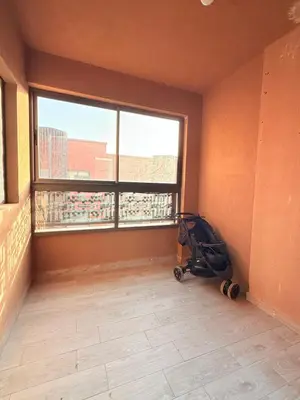 a room with a stroller in a room with a large window at N17 Agréable Confortable & Près De Gueliz in Marrakech