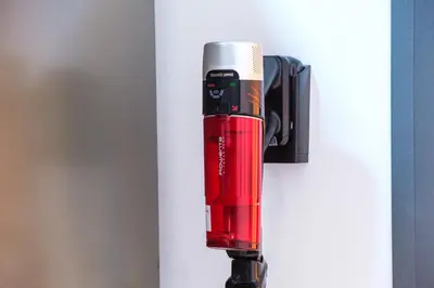 a red fire extinguisher hanging from a wall at 2BR Modern Apt 2min M Avenue Balcony Fiber WiFi 2 Pools 24 7 Security Hivernage in Marrakech