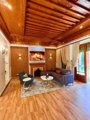 a living room with a couch and a table at VILLA 34 - 4 Masters, Moroccan Charm & Modern Comfort with Private Pool in Marrakech