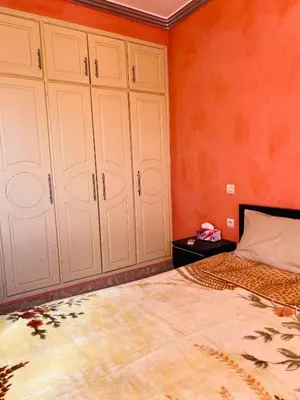 a bedroom with white cabinets and a bed at Apartment Msholidays 1 CH Marrakech pool in Marrakech