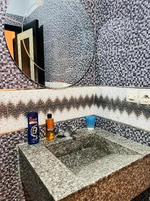 a bathroom with a sink with a mirror at Apartment Msholidays 1 CH Marrakech pool in Marrakech