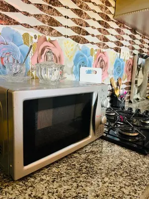 a microwave on a counter in a kitchen at Apartment Msholidays 1 CH Marrakech pool in Marrakech