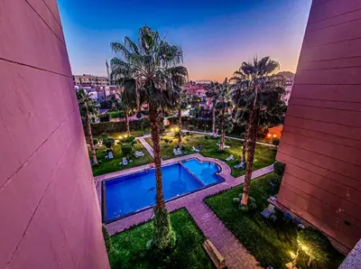 an overhead view of a swimming pool and palm trees at Apartment Msholidays 1 CH Marrakech pool in Marrakech