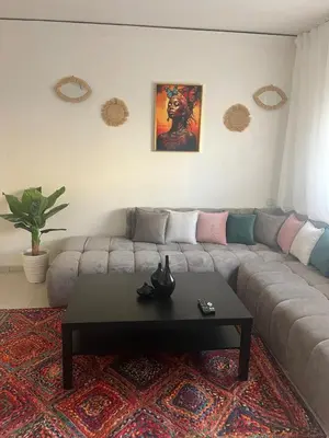 a living room with a couch and a coffee table at Au cœur de la ville ocre in Marrakech