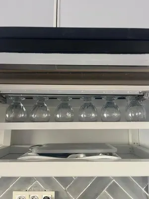 a drawer filled with wine glasses in an oven at Au cœur de la ville ocre in Marrakech