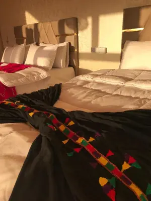 two beds sitting next to each other in a bedroom at Quad Alia Marrakech in Marrakech