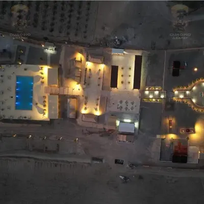 an aerial view of a building at night with lights at Quad Alia Marrakech in Marrakech