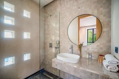 a bathroom with a sink and a mirror at Sublime Villa Neuve Marrakech - Piscine Chauffée in Marrakech