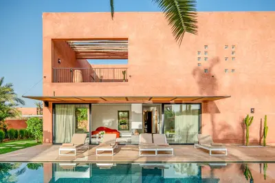 a villa with a swimming pool and a house at Sublime Villa Neuve Marrakech - Piscine Chauffée in Marrakech