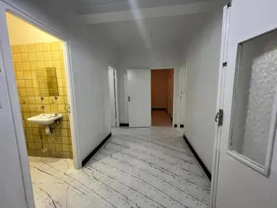 an empty bathroom with a sink and a mirror at Résidence zitouna in Marrakech