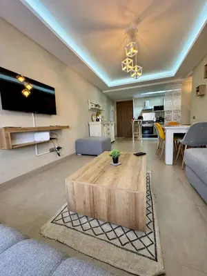 a living room with a couch and a table at Charming appartement 1 bed in Guéliz in Marrakech