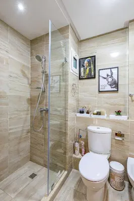 a bathroom with a toilet and a shower at Stylish Cozy Appartement in marrakech with Pool in Marrakech